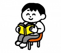 椅子に座り本を読…